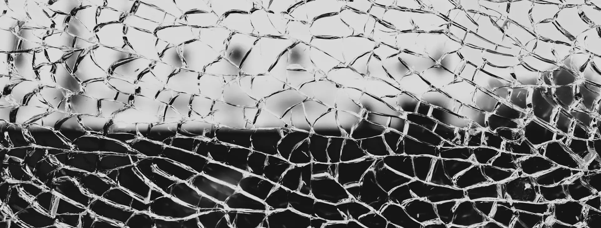 grayscale photo of chain link fence